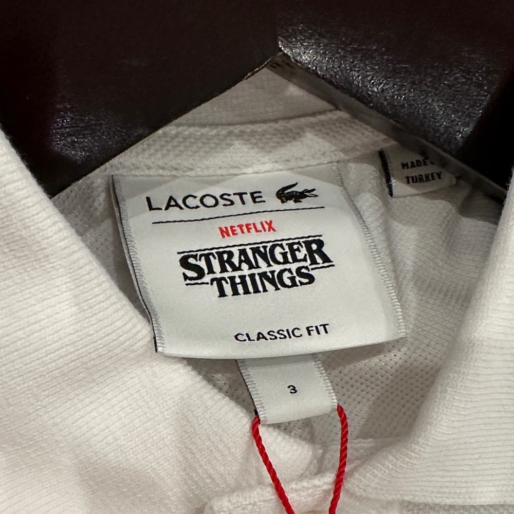 Lacoste White Polo with Stranger Things Logo… never worn! Tags on! - Picture 2 of 3
